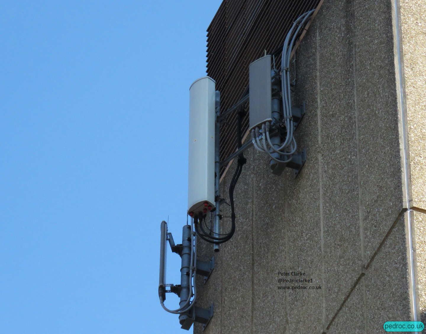 Commscope Tri-Band in between a pair of old Orange antennas on each sector of this site at St Crispins House Norwich.