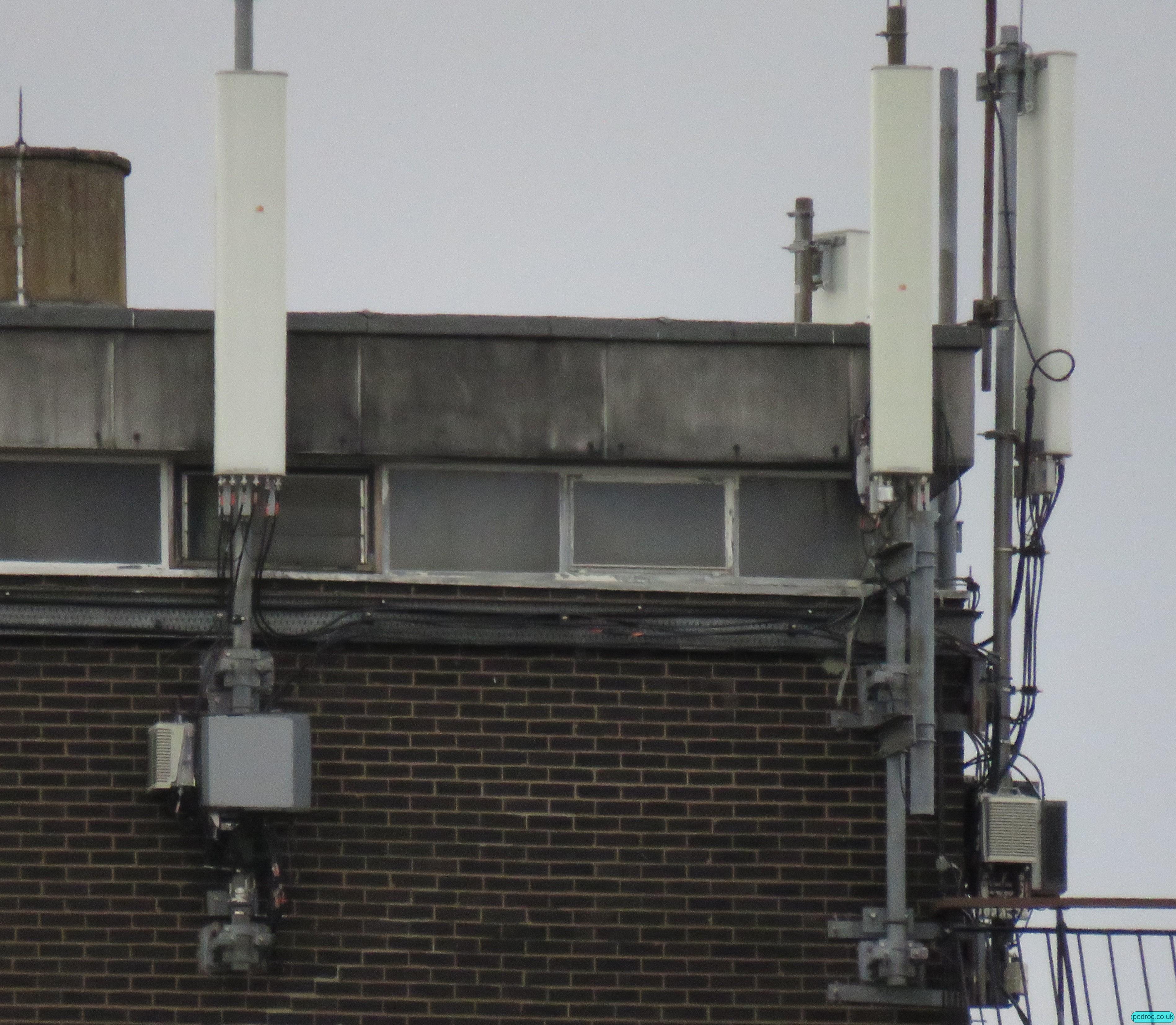 VF host Nokia MORAN mast closeup with dual and triple band Huawei antennas, Nokia RRUs. 